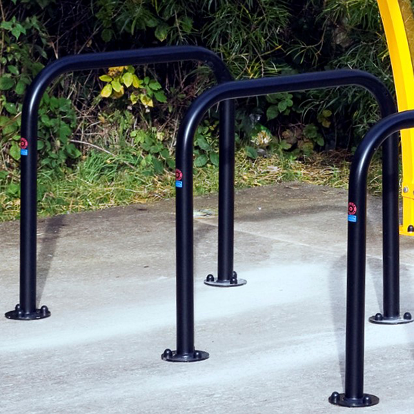 This Sheffield Cycle Stand is made from mild galvanised steel, with a black coated finish. Available in both concrete in and bolt down fixtures, this cycle stand can be used in many different applications. These include transport hubs, public parks, workplaces and schools.

Its innovative tubular design allows bikes to be secured by the frame, wheels and forks. The 48mm diameter tube size allows for most bike locks to be fitted with ease.