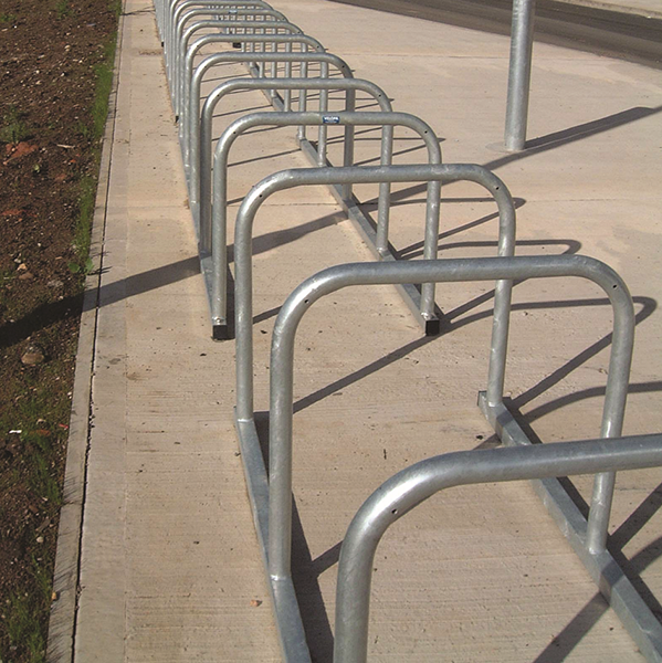 This Sheffield Cycle Toast Rack is the ideal choice for cycle storage in applications where a large number of cycle parking spaces are required.

The benefit of the toast rack rather than individual stands is that installation costs are reduced, as only the four corners need to be bolted down. In addition, the rails are placed in equal intervals, making it an excellent choice for uses with where large quantities are needed.