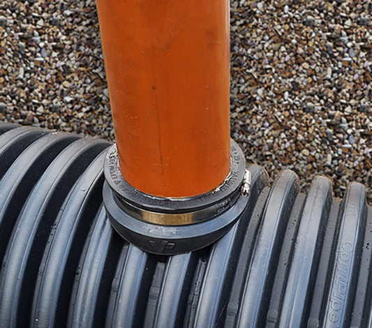 Optimise your drainage system with the 110mm Twinwall Pipe Saddle Adaptor. This premium component is designed to enable a 90° lateral connection into twinwall, corrugated, and ribbed pipes, making it an ideal solution for stormwater applications.

When properly installed, they can withstand internal pressures up to 0.5 bar. The saddle's seal is reinforced with straps that encircle the exterior of the main pipe, providing a reliable and durable connection.