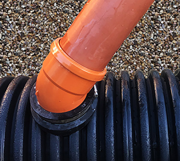 Optimise your drainage system with the 160mm Twinwall Pipe Saddle Adaptor. This premium component is designed to enable a 45° lateral connection into twinwall, corrugated, and ribbed pipes, making it an ideal solution for stormwater applications.

When properly installed, they can withstand internal pressures up to 0.5 bar. The saddle's seal is reinforced with straps that encircle the exterior of the main pipe, providing a reliable and durable connection.